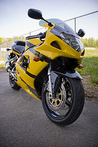黄色摩托车轮子赛车手闲暇驾驶竞赛信号赛车乐趣经济车轮图片