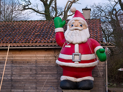 圣诞主题 传统的圣诞圣诞老人幸福娃娃假期帽子玩具男性戏服快乐季节庆典图片