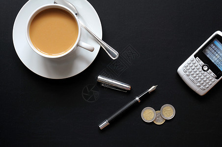 咖啡笔电话和纸工作咖啡银行业文书杯子库存利润商业投资经济图片