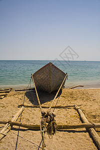 海滩上渔船旅行夹板浮标磨损码头海洋蓝色木头束缚绳索图片