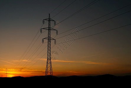 日落时的高压电压电柱日出力量电气燃料技术电子金属橙子车站框架图片