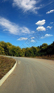 向上山坡的弯曲公路驾驶天空场景运输交通曲线沙漠沥青车道土地图片