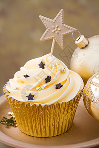 圣诞纸杯蛋糕饮食雪花食物甜点金子派对烘焙盘子磨砂烘烤图片