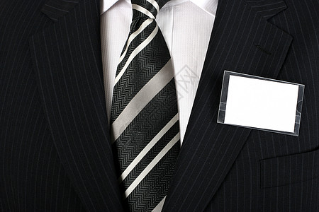 一个穿好衣服的男人身上的空白名牌口袋销售人员衬衫职业标签管理人员打扮商务商业套装图片