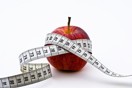 带有测量磁带的红苹果减肥水果厘米白色红色数字食物饮食损失重量图片