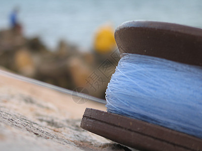 鱼线紧闭蓝色尼龙棕色卷轴细绳工具金属运动图片