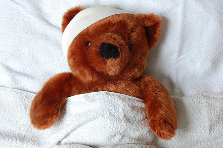 床上受伤的生病泰迪悲伤卧室伤口保险孩子们发烧痛苦玩具熊治愈病人图片