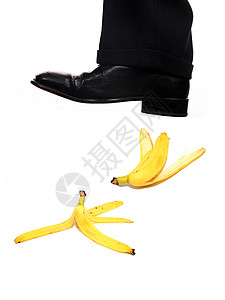 商务人士鞋踏香蕉业图片