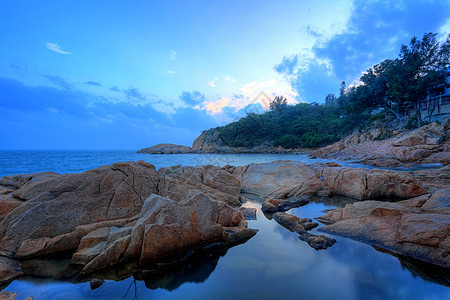 海岸日落 香港张洲旅行季节岩石太阳橙子晴天阳光蓝色天气天空图片