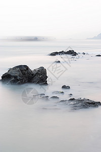 岩石海岸背景反射海岸线热带冲浪旅行蓝色日落阳光石头地平线图片