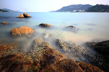 香港带岩石的海岸环境季节旅行阳光日落天气晴天天空旅游反射图片