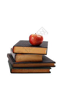 红苹果在白纸上被隔绝的书堆上的红色苹果图片