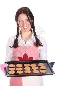 美丽的家庭主妇炫耀蛋糕厨师工作饼干女性厨房奶油混合器巧克力食谱青年图片