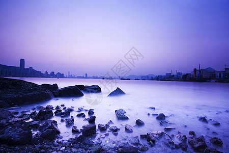 以及岩石海岸的外景冲浪假期日落热带天空风景地平线海浪太阳石头图片