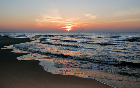 海日日落旅行海浪海滩边缘阳光波纹棕色海洋气候摄影图片