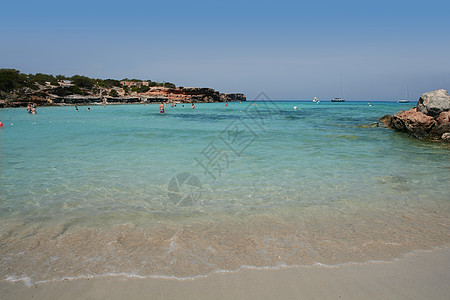 Cala Saona海滩卡拉萨纳海滩天空海岸热带乐趣游客蓝色太阳海景季节地平线图片