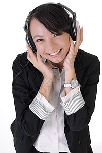 快乐的年轻商业女青年工作室商务工作套装音乐播放器幸福闲暇人士办公室娱乐图片