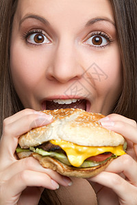 妇女吃汉堡包营养午餐黑发眼神包子快乐女性食物女孩饮食图片