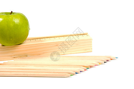 木制学校铅笔和有规则和苹果的持有者图片