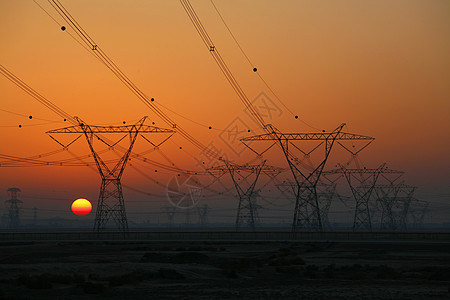 日落时用电塔活力天空电线电缆水电橙子公用事业太阳电气塔架背景