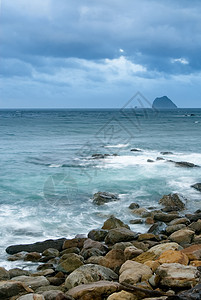 岩石海岸和美丽云彩的风景太阳天空冲浪热带海浪日出蓝色地平线日落天堂图片