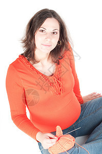 漂亮孕妇编织的肖像橙子肚子母性父母姿势成人女性女孩针织腹部图片