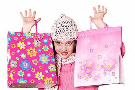 带有购物袋的女孩惊喜销售礼物花费幸福闲暇微笑季节乐趣披肩图片