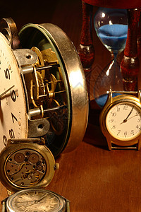 老手表时间概念机制滴漏小时木头时钟机件手表齿轮概念性背景