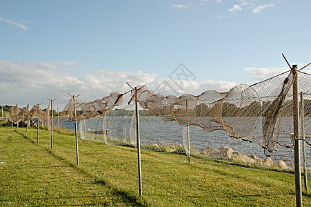 渔网网尼龙商业绳索工业航海齿轮支撑橙子漂浮海岸图片