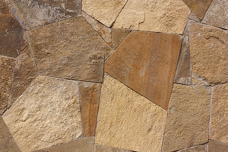 由岩石制成的墙壁结构历史石墙石头材料建筑石工棕色褐色图片