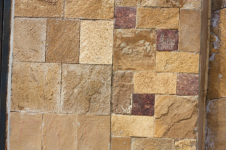 由岩石制成的墙壁结构褐色历史石头材料石墙建筑石工棕色图片