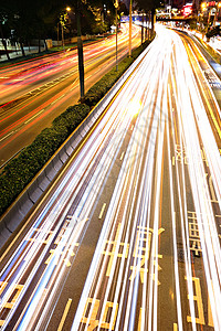 夜间与城市交接戏剧性旅行线条公共汽车街道蓝色交通辉光速度市中心图片