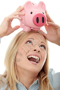拥有小猪银行的女商务人士银行业小猪银行金发女郎商业安全快乐女性女孩金融图片
