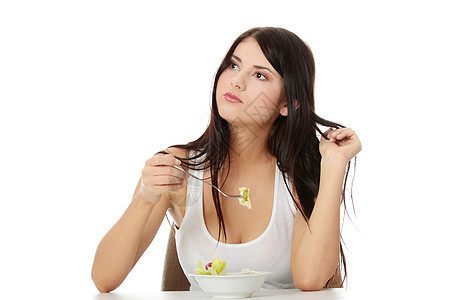 一个女孩吃沙拉的肖像饮食黑发午餐女士白色女孩盘子微笑女性快乐图片