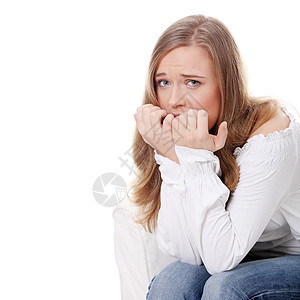 紧张的年轻女人 吃她的指甲金发情绪情绪化咀嚼焦虑相机压力女士成人女性图片