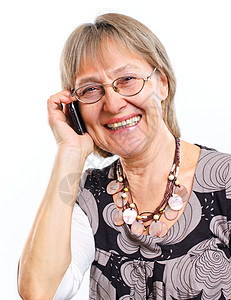 快乐的老年女子与可爱的笑容生活喜悦祖母乐趣退休头发女士女性电话图片