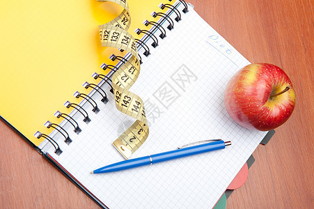 规划饮食日记桌子食物乐器笔记本减肥蓝色木头螺旋药品图片