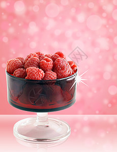 装在玻璃红色碗里饮食植物群营养植物覆盆子杯子火花水果花园乐趣背景图片