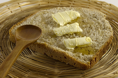 面包加黄油和蜂蜜图片