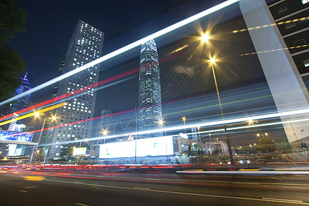 夜间在香港的交通运输市中心公共汽车戏剧性天际城市辉光速度摩天大楼运动图片