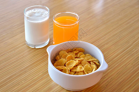 早餐玻璃面包橙子玉米片食物把手营养桌子杯子牛奶背景图片