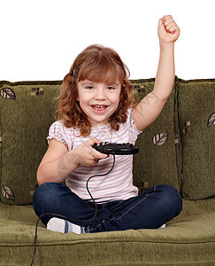 小女孩玩电子游戏 赢图片