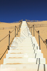 天空的阶梯天气沙漠阳光地形沙丘橙子海岸黄色土地地平线图片