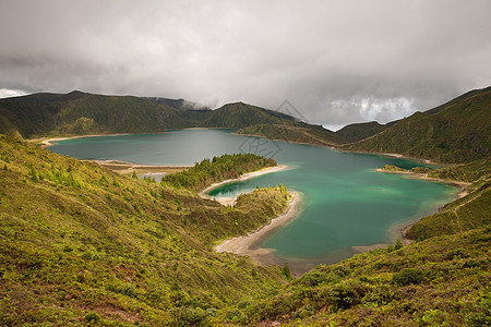 卡尔德拉山脉天空石头火山口地平线蓝色气候丘陵房屋地球图片