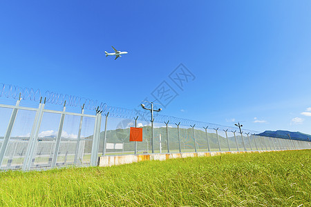 飞机飞越香港草地上空图片