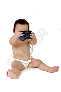 一个胖胖的小女孩照片 与古老相机图片
