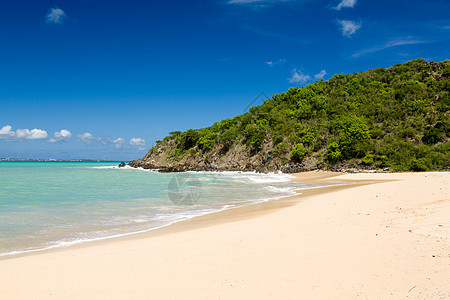 圣马丁加勒比海沿岸的快乐湾旅游海岸冲浪天空太阳明信片海岸线支撑假期热带图片