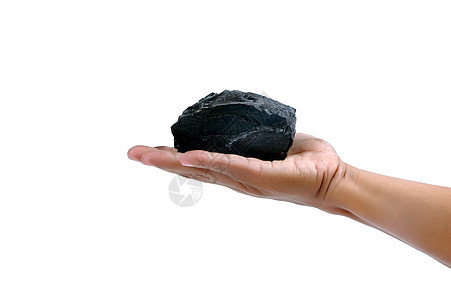 男性手握着一小块煤炭燃料地球灰尘石头商品岩石资源库存矿物工作室图片
