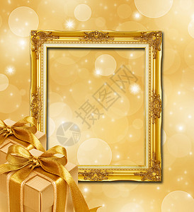 带有框架和黄金礼品盒的圣诞背景摘要金本图片