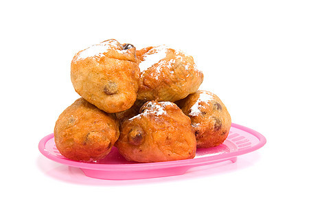 荷兰甜甜圈也称为oliebollen食物游乐场橄榄球商品葡萄干糖果国家盘子传统派对图片